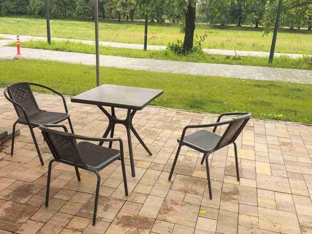 Completed concrete patio with outdoor seating area and clean paver layout in Beachwood, OH