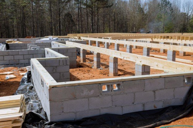 Concrete block foundation with floor framing system installed during new home construction in Shaker Heights, OH