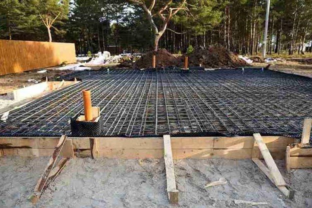 Reinforced concrete slab foundation with steel rebar grid prepared for pouring in Beachwood, OH