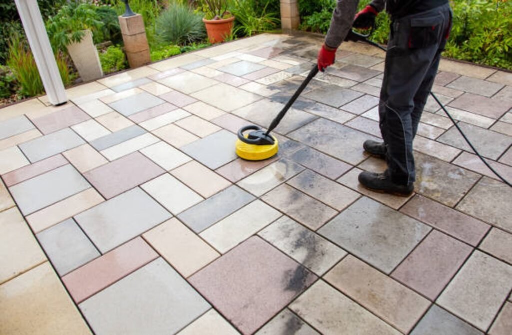 Cleaning and sealing decorative stamped concrete patio surface in residential backyard in Beachwood, OH