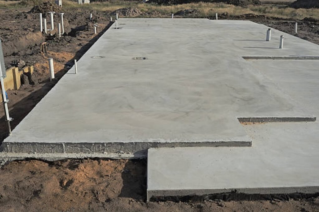 Newly poured concrete slab foundation with smooth finish and structural layout in Shaker Heights, OH